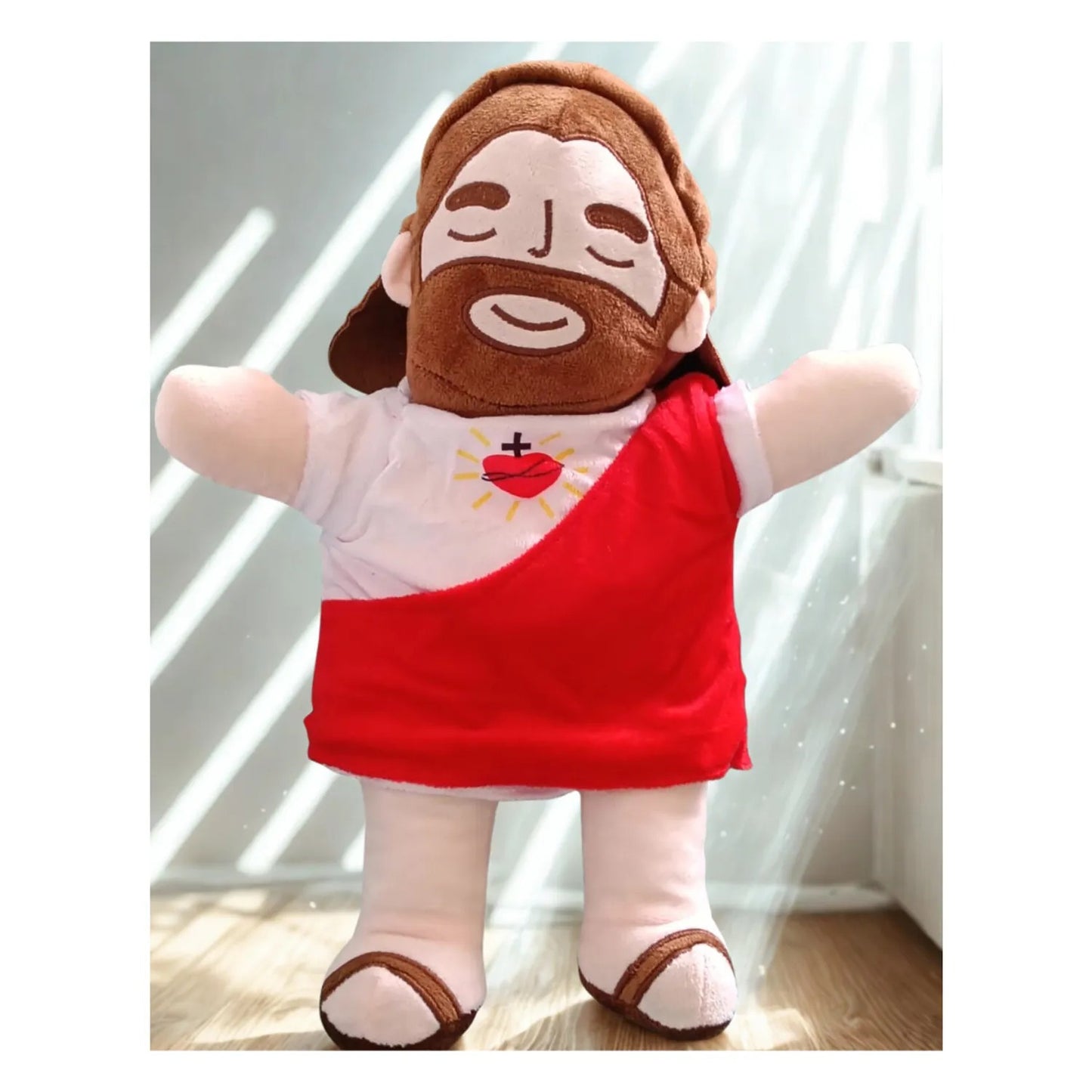 Peluche Jesús que abraza y brilla